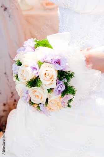 Photo: wedding bouquet at bride's hands wedding bouquet at bride's hands
