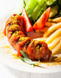 Currywurst with french fries and salad