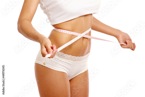 Photo: Waist of the girl. Isolated on white background Waist of the girl. Isolated on white background
