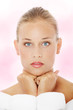 Foto: Beautiful woman in bathrobe. Beautiful woman in bathrobe.