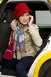 Woman exits a Taxi