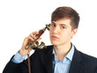 Photo: young man talking on retro phone young man talking on retro phone