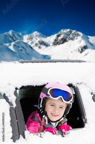 Photo: Winter holiday - happy child on the road for winter holidays Winter holiday - happy child on the road for winter holidays