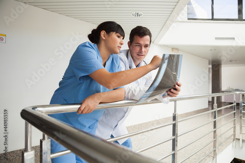 Photo: Nurse asking the doctor about x-ray Nurse asking the doctor about x-ray