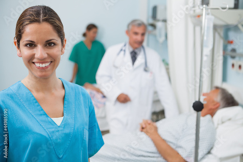 Photo: Happy nurse in hospital room Happy nurse in hospital room