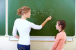 By the blackboard