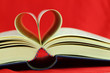 Selective focus image of book pages folded into a heart shape