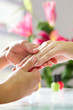 Woman in nail salon receiving hand massage