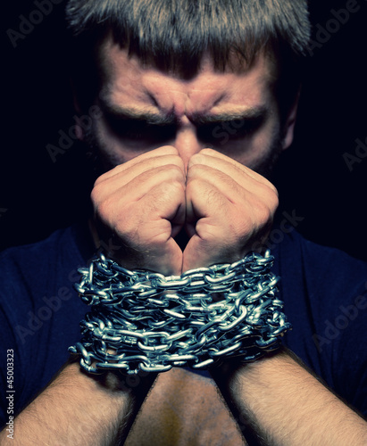 Photo: Chained man Chained man