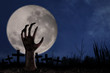 Zombie hand on graveyard