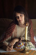 Beautiful Caucasian woman sitting at a table writing