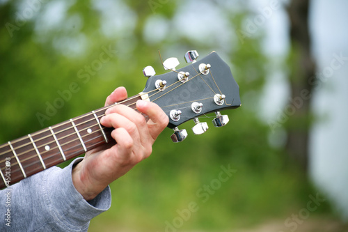 Photo: boys hand with a guitar boys hand with a guitar