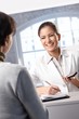 Laughing receptionist with client