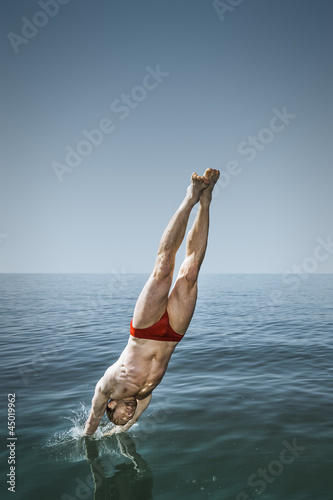 Photo: man jumping in the lake man jumping in the lake
