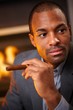 Portrait of handsome black man with cigar