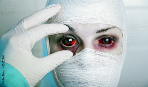 Photo: Evil doctor checking results of genetic experiment Evil doctor checking results of genetic experiment