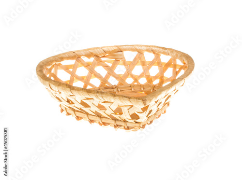Photo: Wickerwork empty yellow breadbasket on white background Wickerwork empty yellow breadbasket on white background