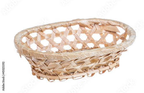 Photo: Wickerwork empty yellow breadbasket on white background Wickerwork empty yellow breadbasket on white background