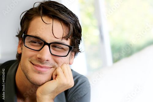 Photo: Portrait of handsome young man with glasses Portrait of handsome young man with glasses