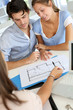 Couple meeting architect for plans of future home