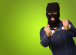 angry criminal man locked in handcuffs