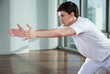 Man Exercising At Gym