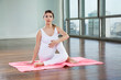 Young Woman Practicing Yoga At Gym