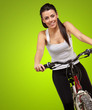 Portrait of a young girl sitting in bicycle