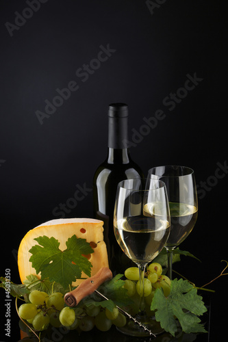 Photo: white wine and cheese on black white wine and cheese on black