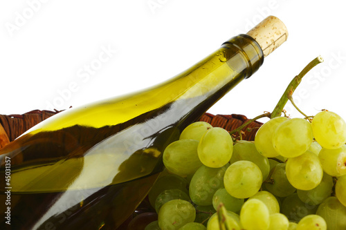 Photo: bottle with white wine and grapes bottle with white wine and grapes
