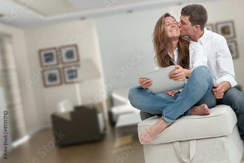 Photo: Young couple at home Young couple at home