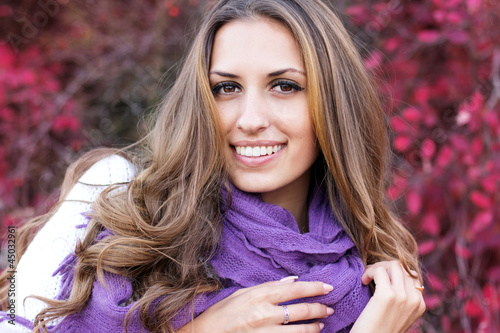 Photo: portrait of beautiful girl in autumn leaves. portrait of beautiful girl in autumn leaves.