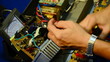 electrician using voltmeter for checking and repair