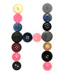 The alphabet from buttons for sewing.