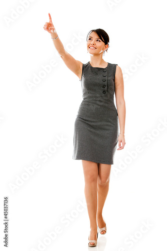 Photo: Businesswoman walking and pointing Businesswoman walking and pointing