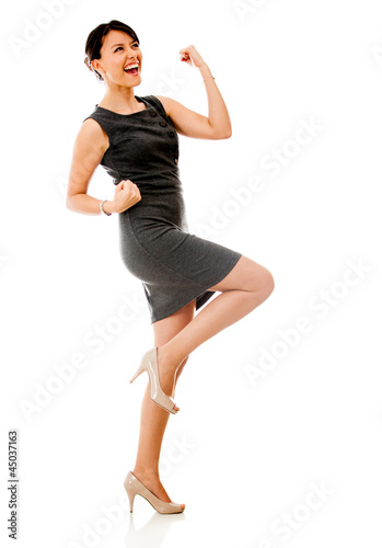 Photo: Successful business woman celebrating Successful business woman celebrating