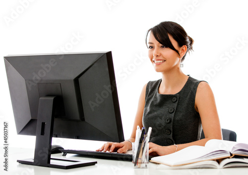 Photo: Business woman working at the office Business woman working at the office