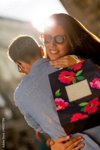 Photo: Woman thankful for her present Woman thankful for her present