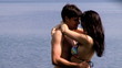 Beautiful couple dancing in the water slow motion