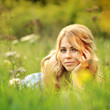 Beautiful girl lying in grass