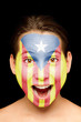 girl with catalan pro-independence flag painted on her face
