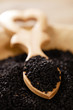 Photo: black cumin or caravay or onion seeds in heart shape wooden spoo black cumin or caravay or onion seeds in heart shape wooden spoo