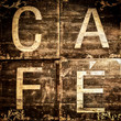 Cafe sign on brown textured background