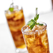 Photo: cold iced tea with mint garnish and sliced lemons cold iced tea with mint garnish and sliced lemons
