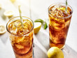 Photo: cold iced tea with straws and lemon slices in summer sun. cold iced tea with straws and lemon slices in summer sun.