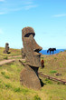 Wild horses next to moai in Rano Raraku