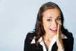 Business woman covering mouth, over blue