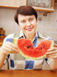 Woman with slice of watermelon