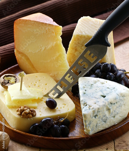 Photo: Still-life cheese platter with nuts and grapes Still-life cheese platter with nuts and grapes