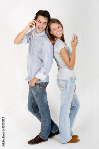 Photo: Cheerful couple using smartphone Cheerful couple using smartphone